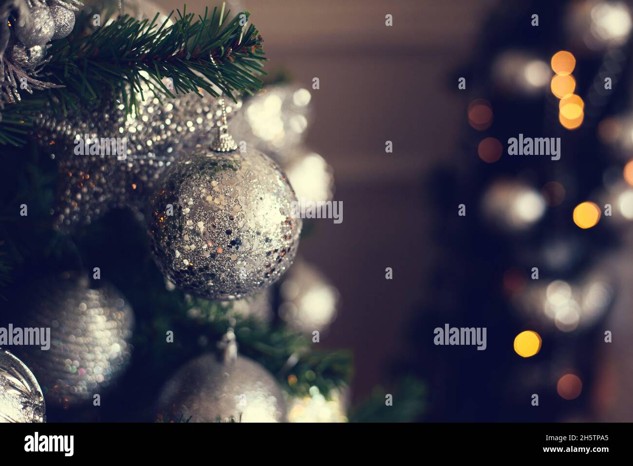 Silver Christmas balls on a fir branch Stock Photo - Alamy