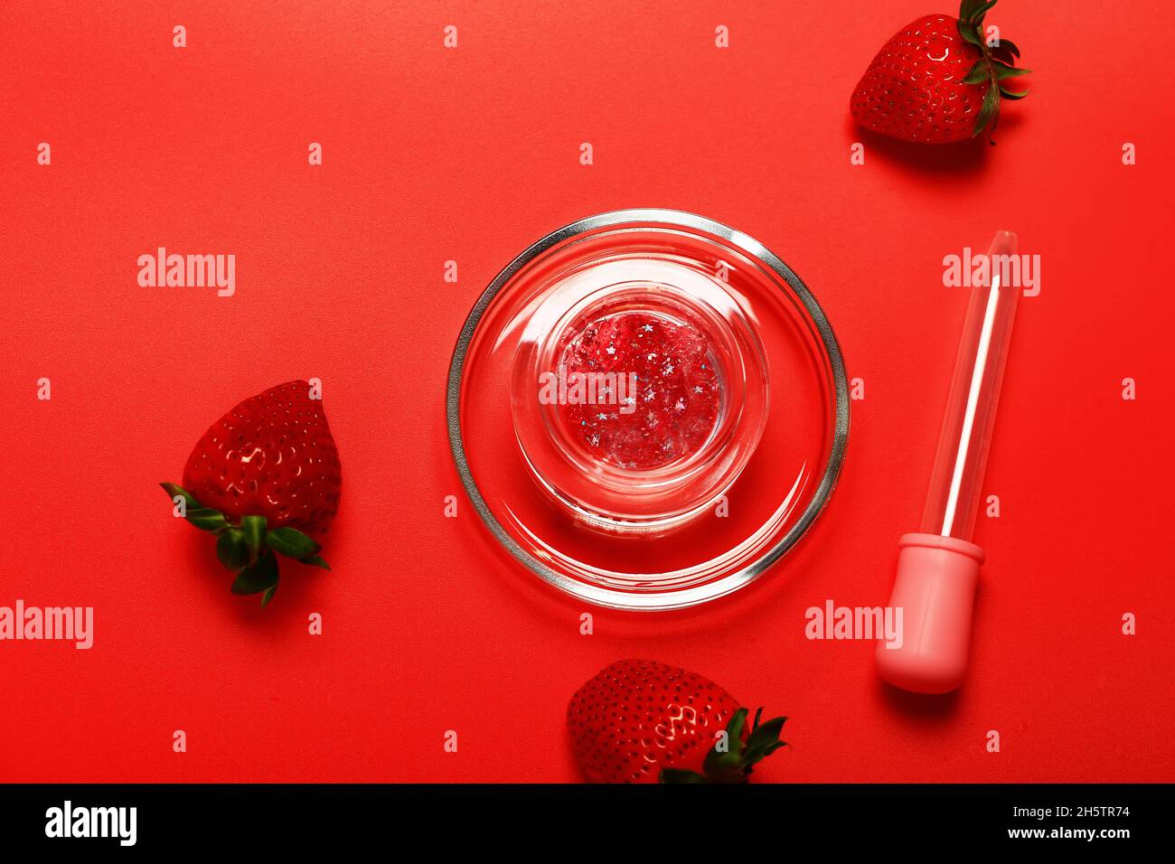 strawberry cleaning radiant facial mask. glitter liquid gel mask Stock