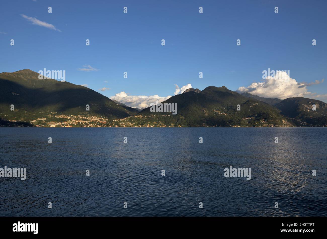 View of Bellano at Lake Como with warm evening sunlight, Italy Stock Photo