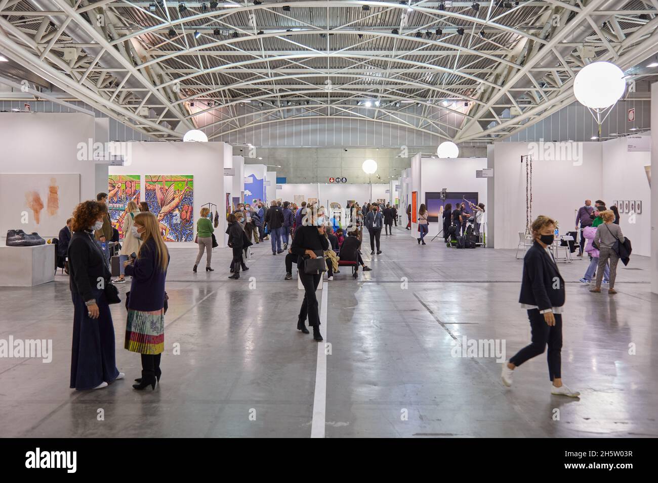 TURIN, ITALY - NOVEMBER 06, 2021: Artissima 2021, people and art collectors at contemporary art fair Stock Photo