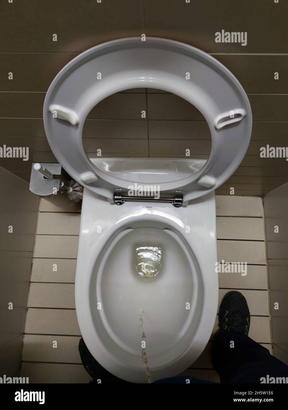 man urinating in public toilet detail Stock Photo Alamy