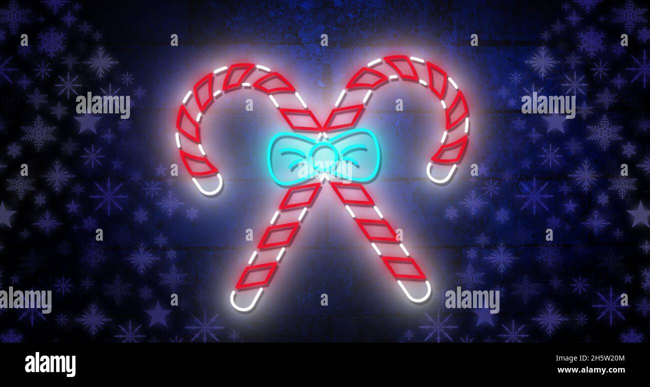 Image of candy canes at christmas over stars Stock Photo Alamy