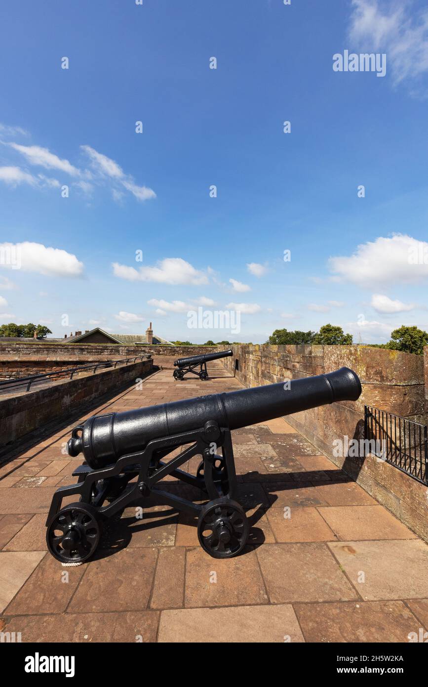 Cannons lined up on the ramparts, Carlisle Castle, an 11th century English castle, Carlisle Cumbria UK Stock Photo