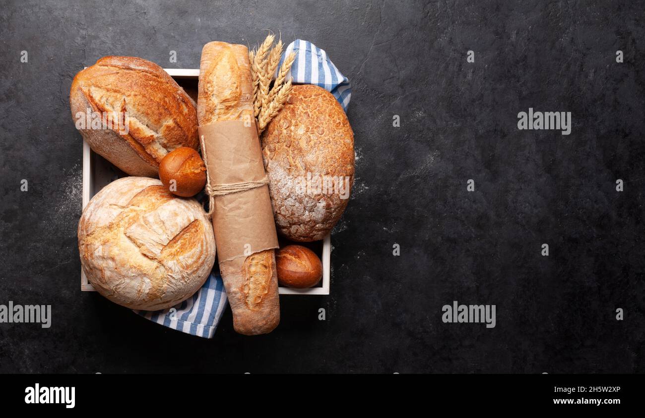 Various types of bread on stone table. Top view flat lay with copy ...