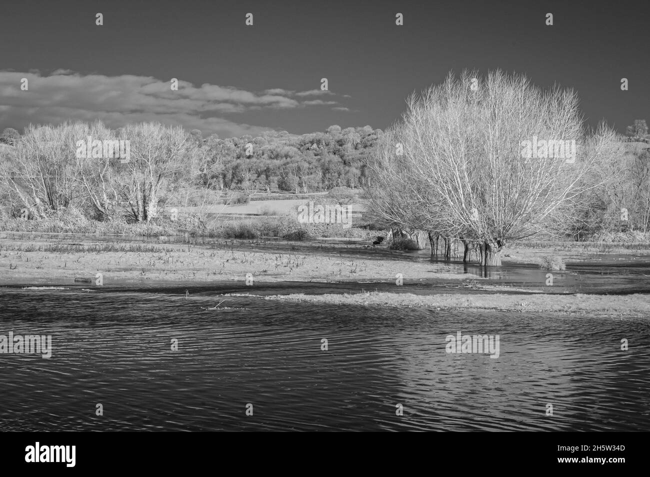 Infrared image of flood waters on Aller Common Moor where River Parrett overflows down the spillway close to Monks Leaze Clyse. Somerset, England, UK Stock Photo