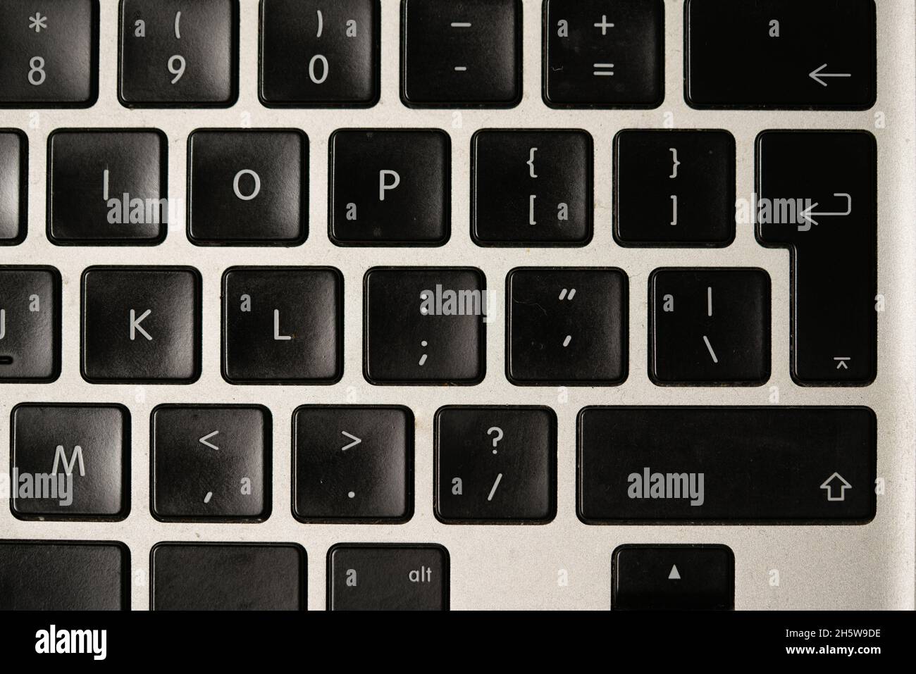 photo of a black qwerty keyboard on a silver background Stock Photo