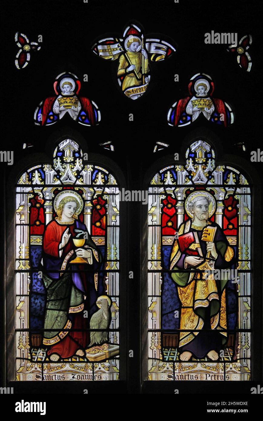 A stained glass window by Lavers Barraud & Westlake of 1908 depicting St John and St Peter, Church of the Holy Cross, Burley-on-the-Hill, Rutland Stock Photo