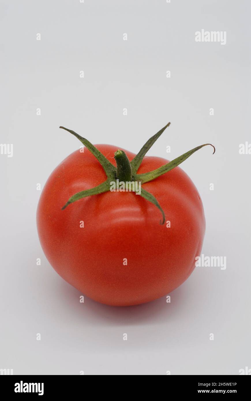 red healthy tomato with stem Stock Photo