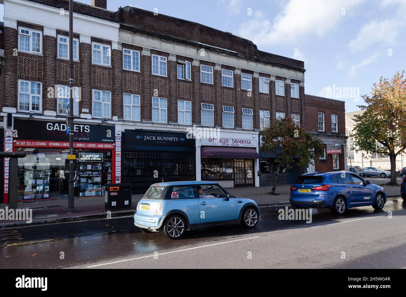 The shops and apartments along station road in Upminster, London, UK