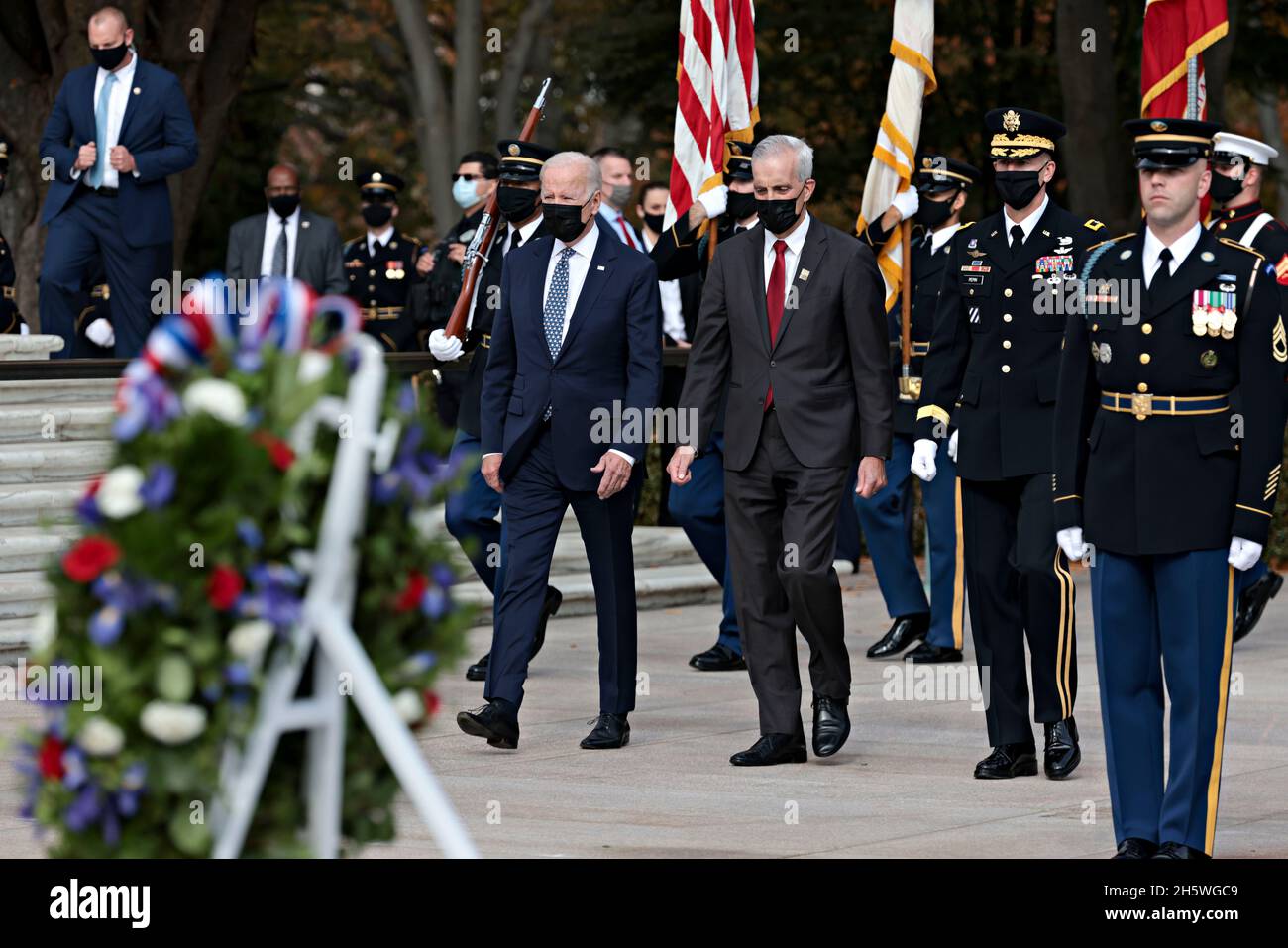 Arlington, USA. 11th Nov, 2021. United States President Joe Biden, left, and US Secretary of Veterans Affairs Denis McDonough, center, participate in a Presidential Armed Forces Full Honor Wreath-Laying Ceremony on the 100th anniversary of the Tomb of the Unknown Soldier at Arlington National Cemetery in Arlington, Virginia, U.S., on Thursday, Nov. 11, 2021. 2021 marks the centennial anniversary of the Tomb of the Unknown Soldier, providing a final resting place for one of America's unidentified World War I service members, and Unknowns from later wars were added in 1958 and 1984. Credit: Oliv Stock Photo