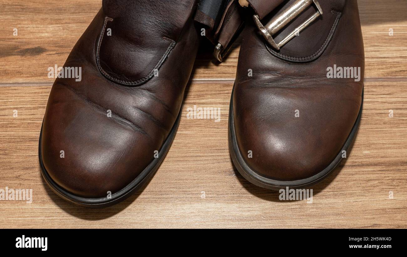 Men's shoe shine. A man applies cream to leather shoes Stock Photo