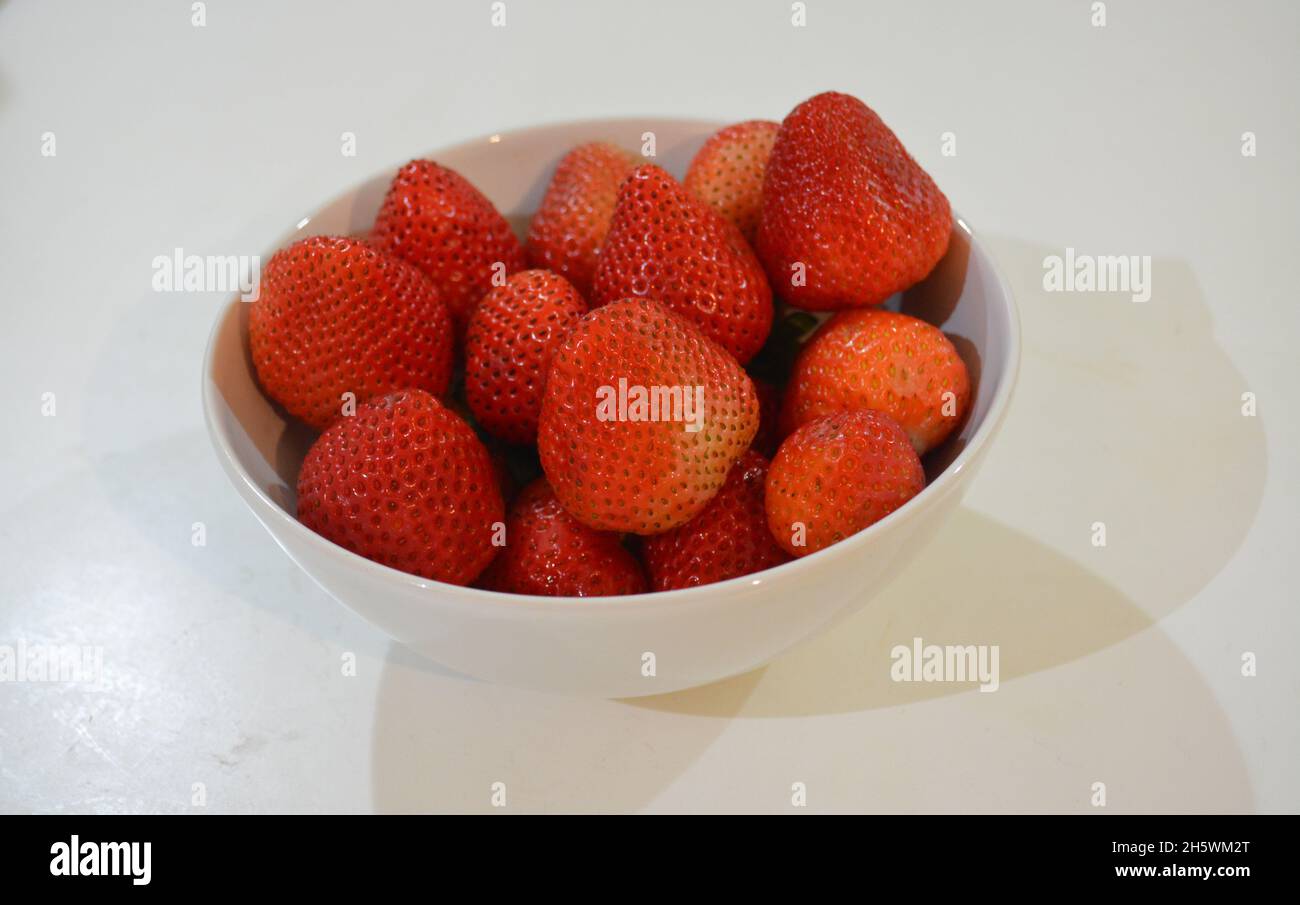 Strawberry in white bowls. Vitamin C Stock Photo Alamy