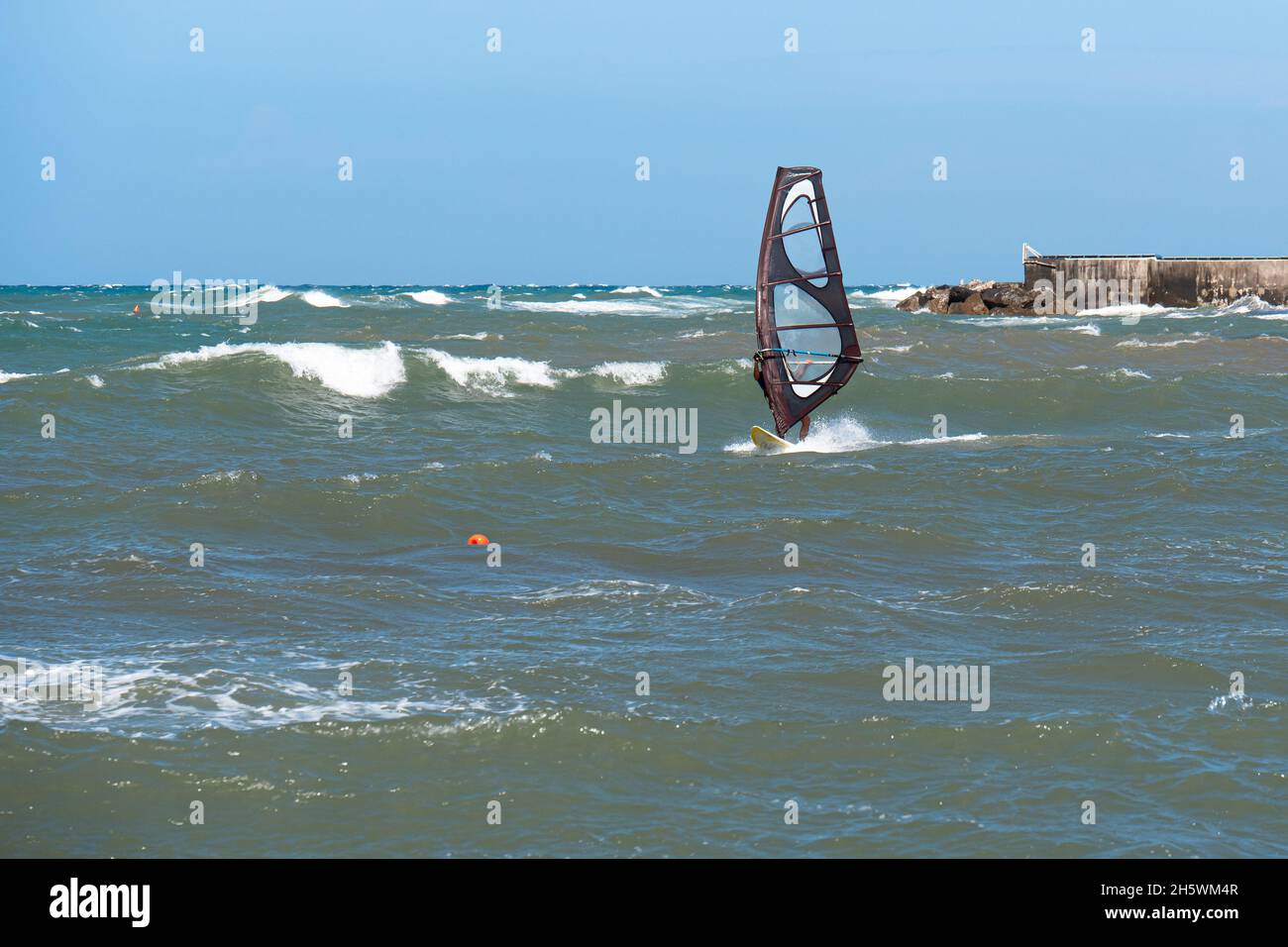 Windsurf Riding the Waves in a Choppy Sea Stock Photo Alamy