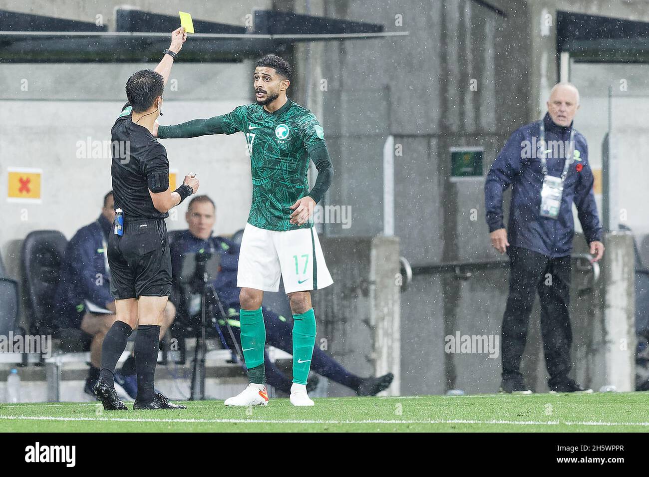 Sydney, Australia. 11th Nov, 2021. The referee gives ABDULELAH ALAMRI of Saudi Arabia a yellow card during the FIFA World Cup AFC Asian Qualifier match between the Australia Socceroos and Saudi Arabia at CommBank Stadium on November 11, 2021 in Sydney, Australia Credit: IOIO IMAGES/Alamy Live News Stock Photo