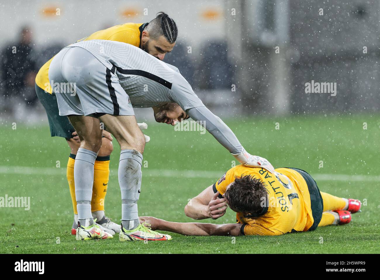 Sydney, Australia. 11th Nov, 2021. MATHEW RYAN of Australia checks up on team mate  HARRY SOUTTAR after a collision during the FIFA World Cup AFC Asian Qualifier match between the Australia Socceroos and Saudi Arabia at CommBank Stadium on November 11, 2021 in Sydney, Australia Credit: IOIO IMAGES/Alamy Live News Stock Photo