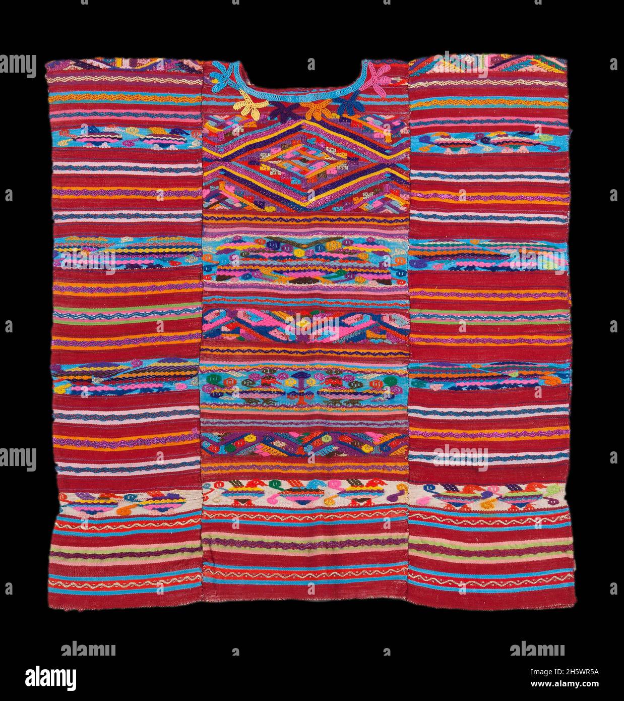 Huipil (women's blouse-type garment) constructed from 3 panels of hip-strap loom woven fabric. The traditional / everyday costume of the Chinanteca is one of the most colourful in Mexico, especially  those from in the villages of Usila and Ojitlán, Oaxaca, Mexico Stock Photo