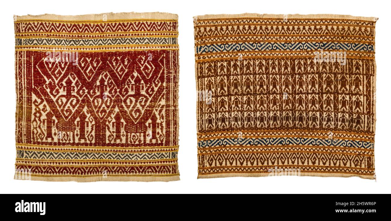 Pair of ceremonial textiles, C19th, Lampung, Sumatra. Tampan were used for rites of passage ceremonies, as the focal point for ritual meals, the seat for elders overseeing traditional law, and tied to newly-built houses. Examples from the mountainous interior show stylised natural or domestic subjects and geometric designs, while those from the coast (tampan pasisir) display richly detailed scenes of ships and other motifs. The ship, the main motif, symbolises movement, appropriate to the rites of passage rituals. Stock Photo