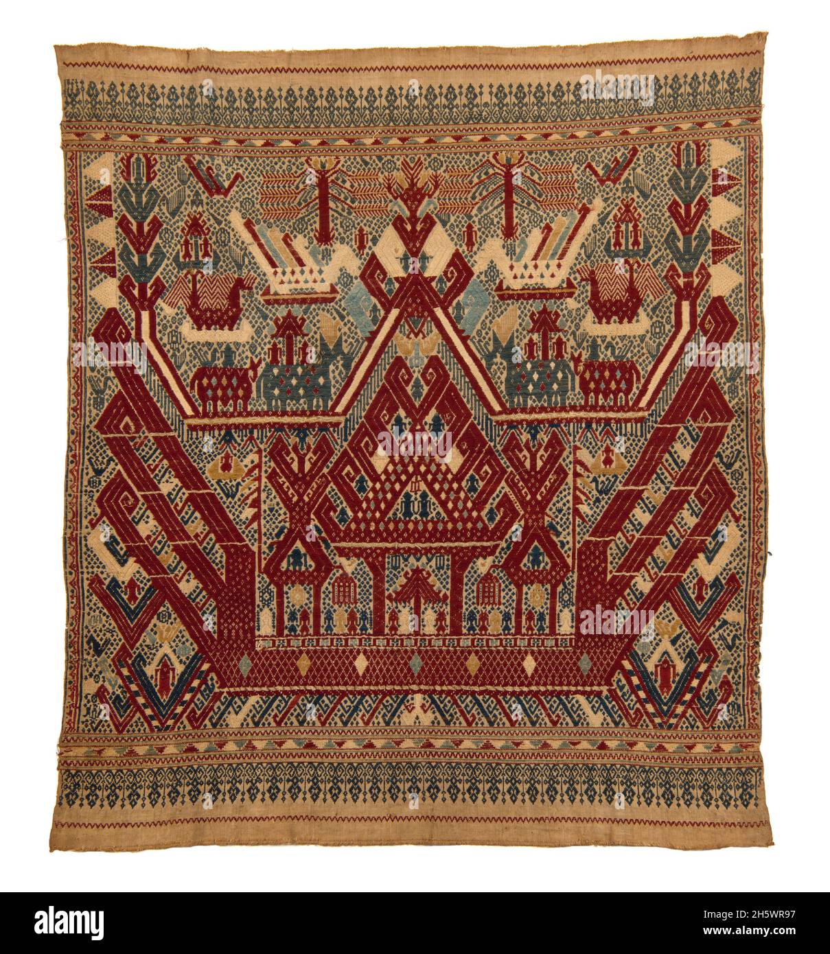 Textile, C19th, Lampung, Sumatra. Tampan were used for rites of passage ceremonies, as the focal point for ritual meals, the seat for elders overseeing traditional law, and tied to newly-built houses. Those woven in blue depict the secular realm, those in red the sacred. Examples from the mountainous interior show stylised natural or domestic subjects and geometric designs, while those from the coast (tampan pasisir) display richly detailed scenes of ships and other motifs. The ship, the main motif, symbolises movement, appropriate to the rites of passage rituals. Stock Photo