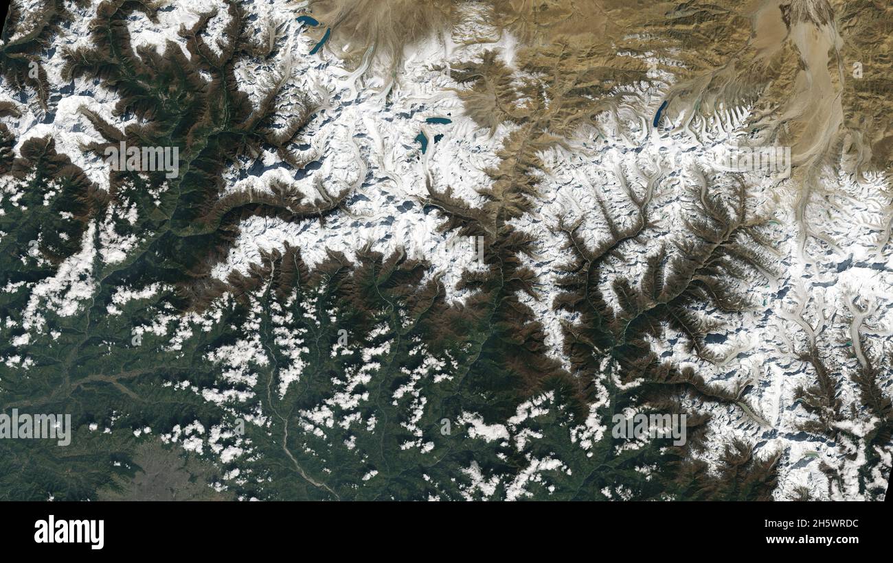Kathmandu, Nepal, bottom left. The city lies in a valley south of the Himalayas between Nepal and China. Glaciers, and the lakes formed by glacial meltwater, are visible in the top middle of this image. Many communities rely on meltwater from glaciers Ð and Landsat can help track how those glaciers are changing in a warming climate. Earlier imagery has documented the shrinkage of glaciers, and changing lake levels on the adjacent Tibetan plateau. Oct 31 2021, the first day of data collection for Landsat 9. An enhanced version of original Landsat 9 imagery. Credit NASA/USGS Stock Photo