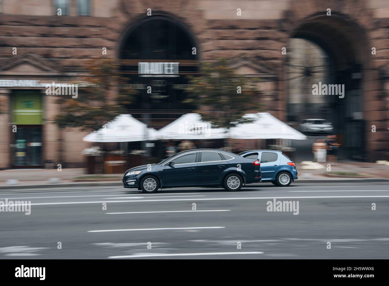 Ukraine, Kyiv - 2 June 2021: Blue Ford Mondeo car moving on the street. Editorial Stock Photo