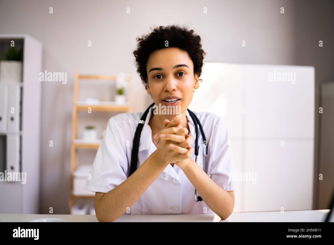 Professional African American Doctor Woman In Video Conference Stock Photo