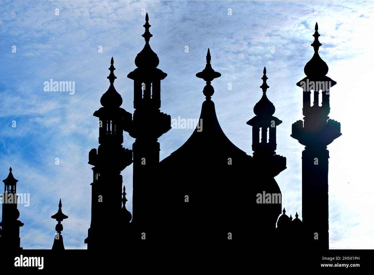 The Indian -inspired architecture of the Georgian period Royal Pavilion, Brighton, East Sussex, England, UK. Silhouetted dome and minarets. Indo-Saracenic Revival. Stock Photo