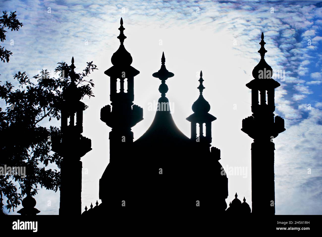 The Indian -inspired architecture of the Georgian period Royal Pavilion, Brighton, East Sussex, England, UK. Silhouetted dome and minarets. Indo-Saracenic Revival. Stock Photo