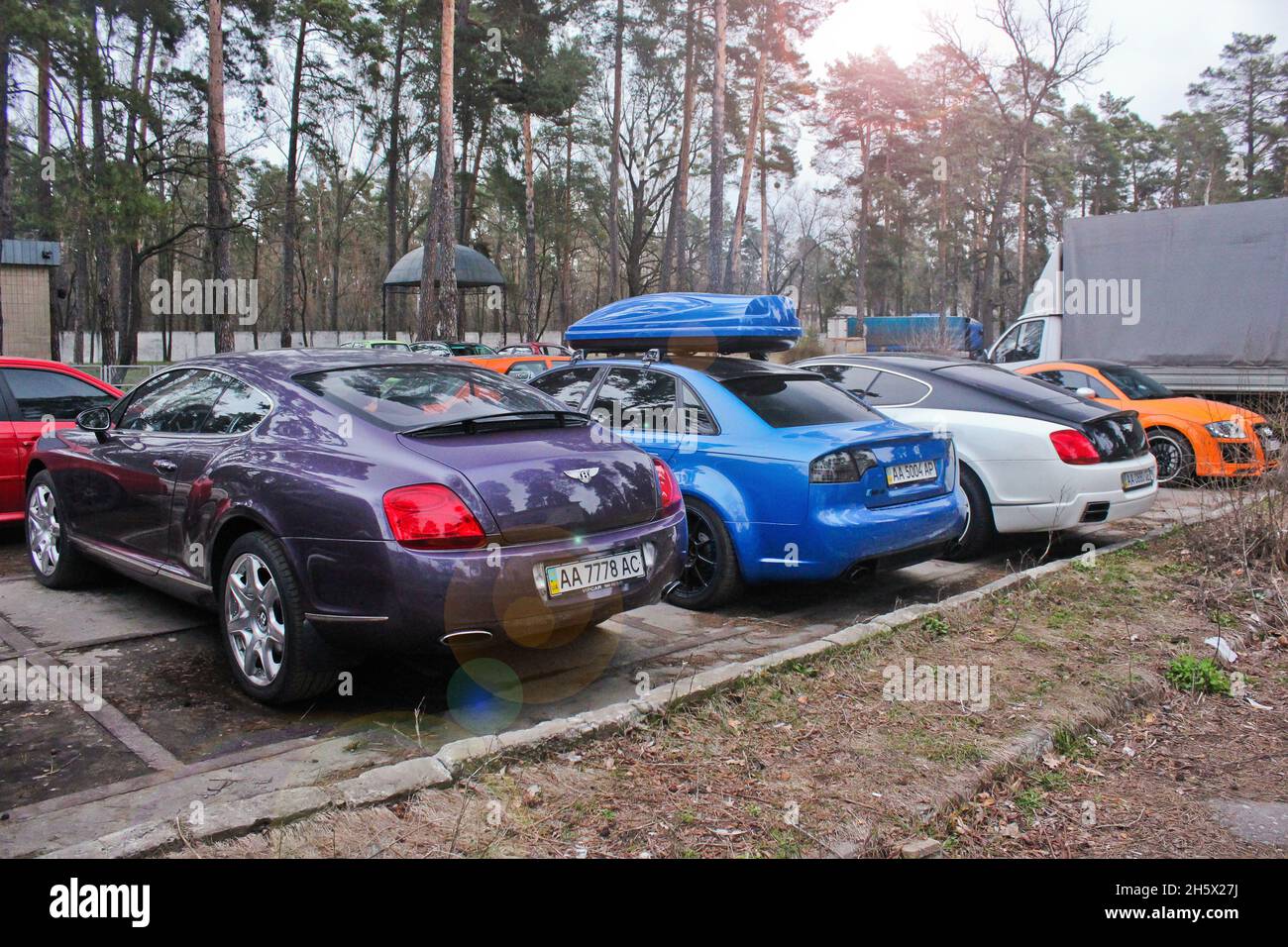 Ukraine, Kiev - April 3, 2015: Super combo of supercars. Purple and white Bentley and blue Audi RS4 and Audi TT. Cars stand in a row Stock Photo