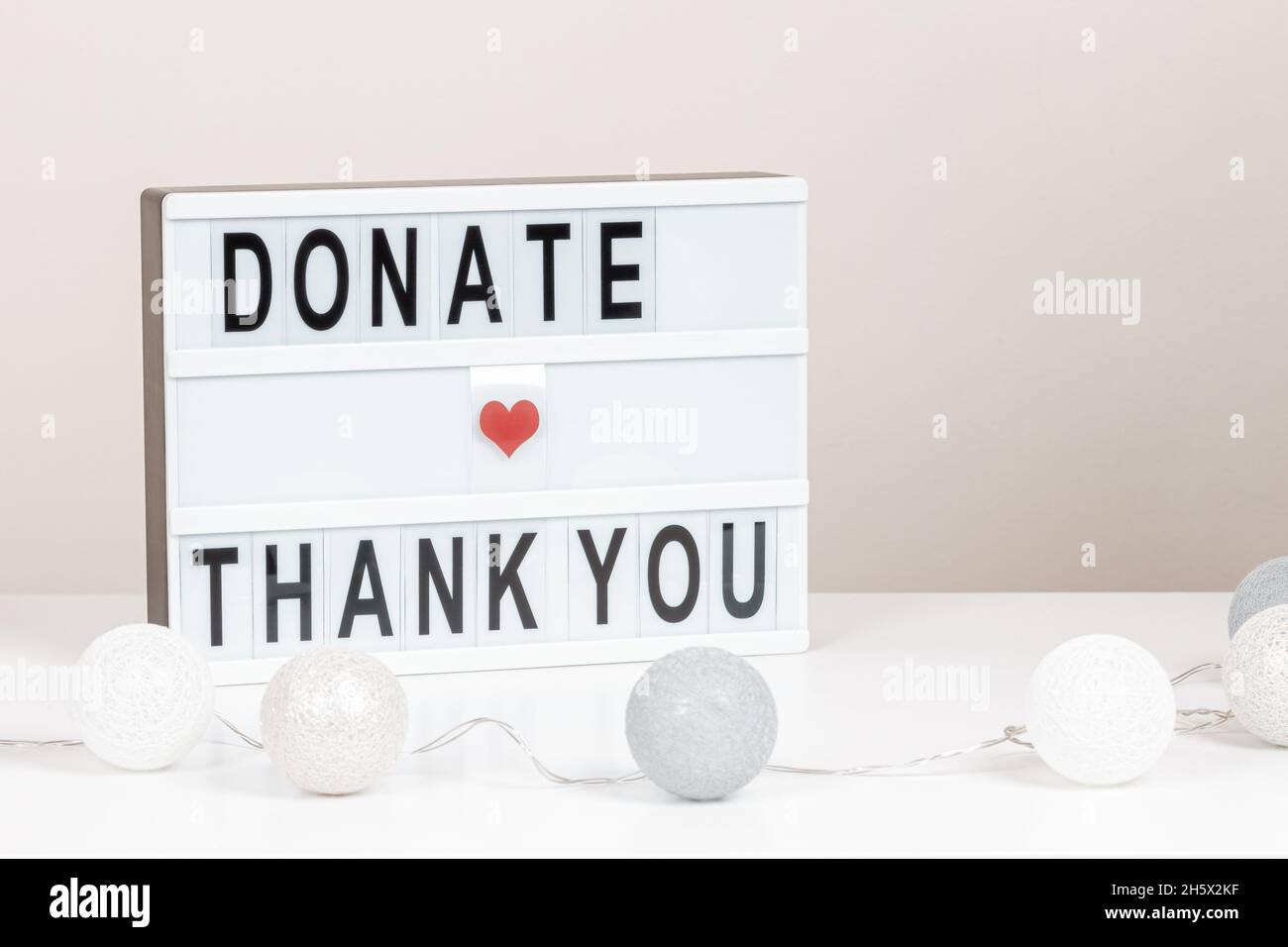 Christmas donation, charity. White lightbox with message Donate and