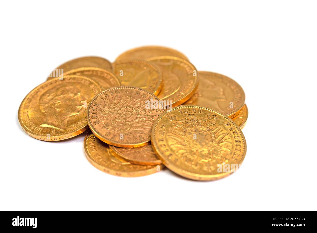 Old gold coins against white background Stock Photo
