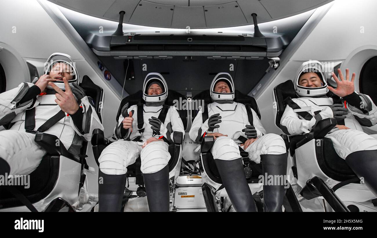 Pensacola, Florida, USA. 8th Nov, 2021. ESA (European Space Agency) astronaut Thomas Pesquet, left, NASA astronauts Megan McArthur and Shane Kimbrough, and Japan Aerospace Exploration Agency (JAXA) astronaut Aki Hoshide, right, are seen inside the SpaceX Crew Dragon Endeavour spacecraft onboard the SpaceX GO Navigator recovery ship shortly after having landed in the Gulf of Mexico off the coast of Pensacola. Credit: Aubrey Gemignani/NASA/ZUMA Wire/ZUMAPRESS.com/Alamy Live News Stock Photo