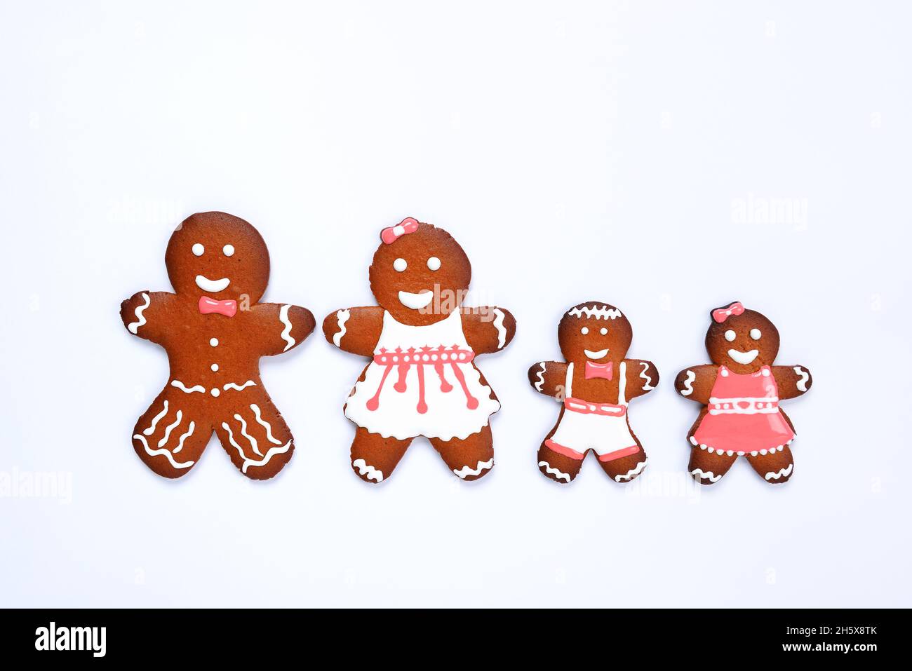 The hand-made eatable gingerbread house, little men on white background Stock Photo
