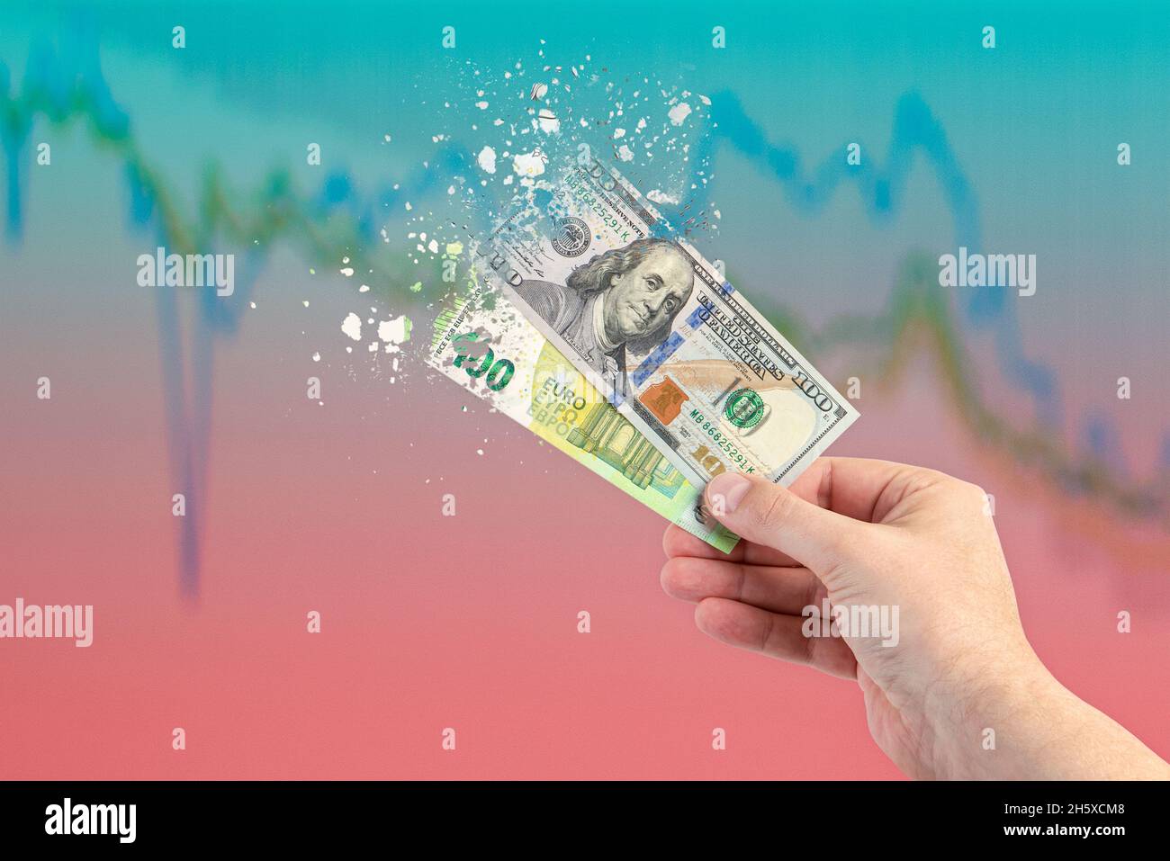 Inflation, hyperinflation, stagflation. One hundred dollar and one hundred euro banknotes splatter on the falling red graph. The concept of inflation Stock Photo