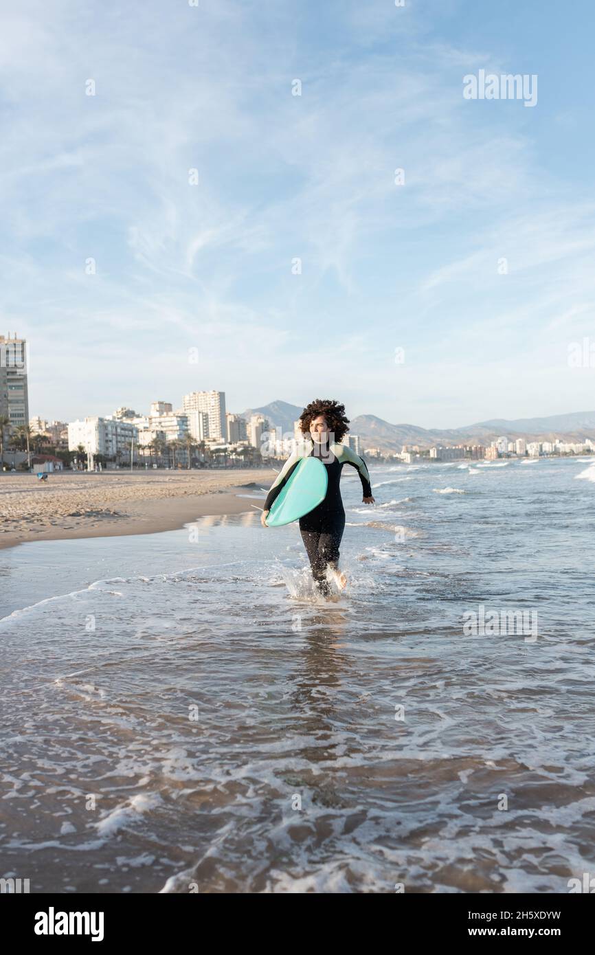 Female surfer surfboard in wetsuit hi-res stock photography and images ...