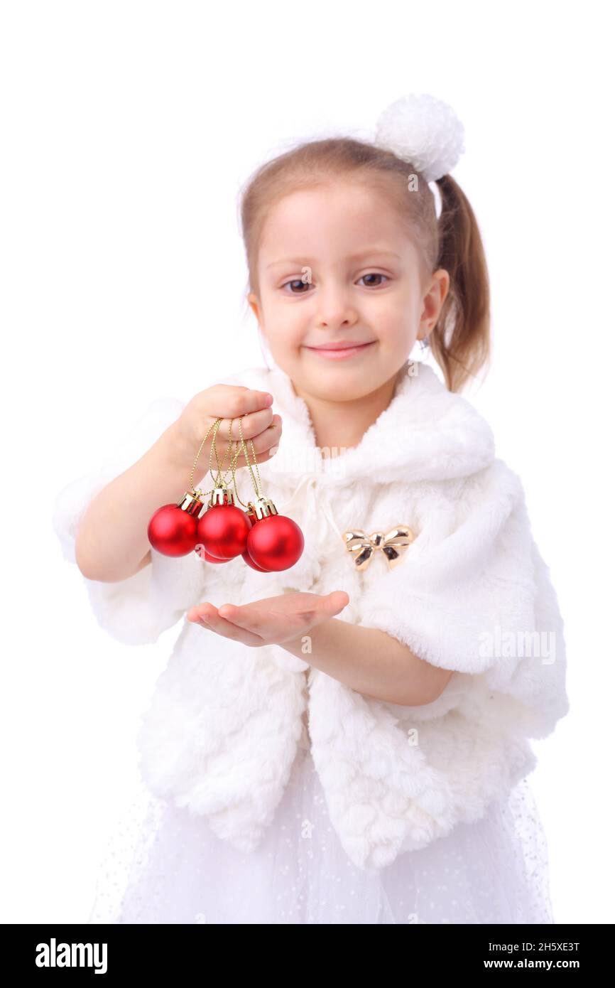 cute little girl with the new year balls, focus on the balls Stock Photo