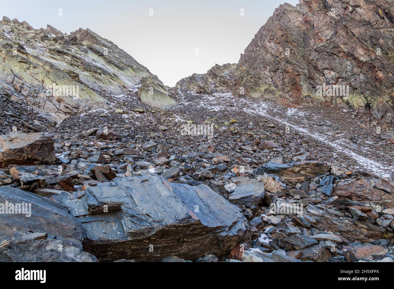 Rocks and snow at the slopes of Coma Pedrosa, highest mountain in ...