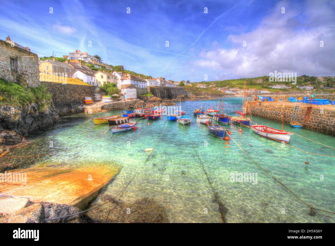Coverack Cornwall beautiful small harbour colourful coast fishing village with boats Stock Photo