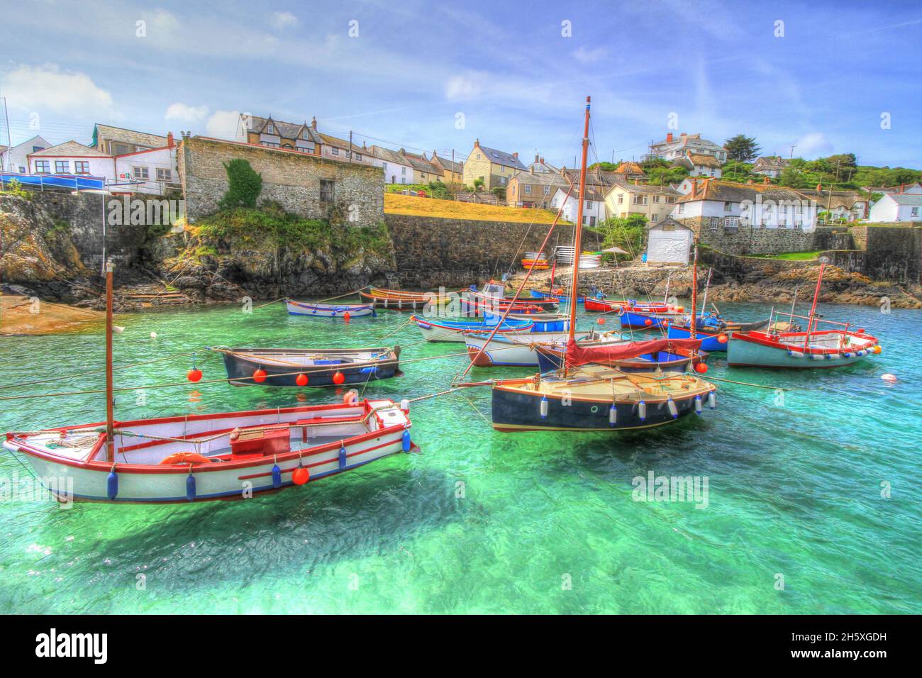 Beautiful Cornish harbour Coverack Cornwall colourful coast fishing village with boats Stock Photo