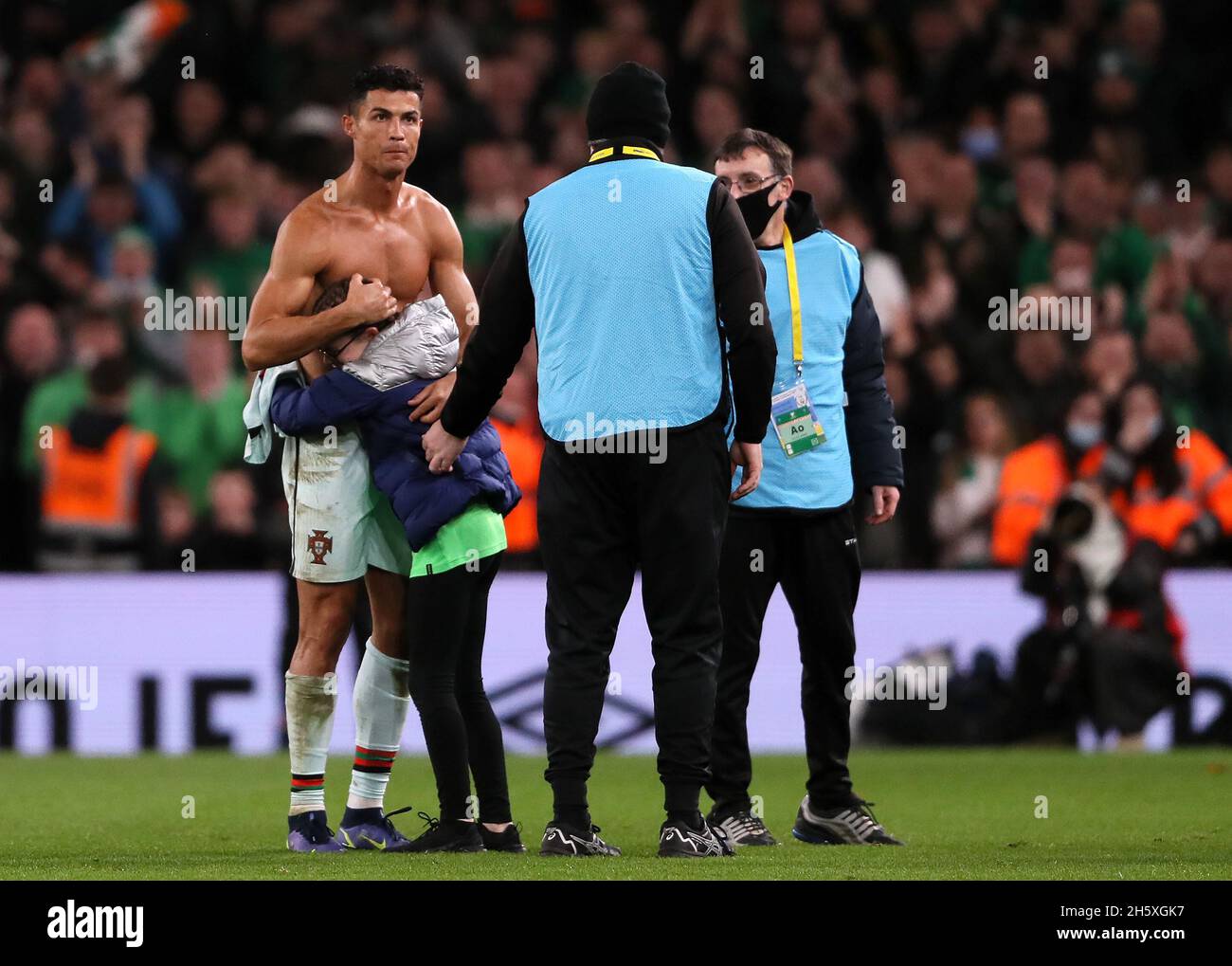 Portugal's Cristiano Ronaldo gives his shirt to a young Republic of Ireland  fan who ran onto the pitch after the FIFA World Cup Qualifying match at the  Aviva Stadium, Dublin. Picture date: