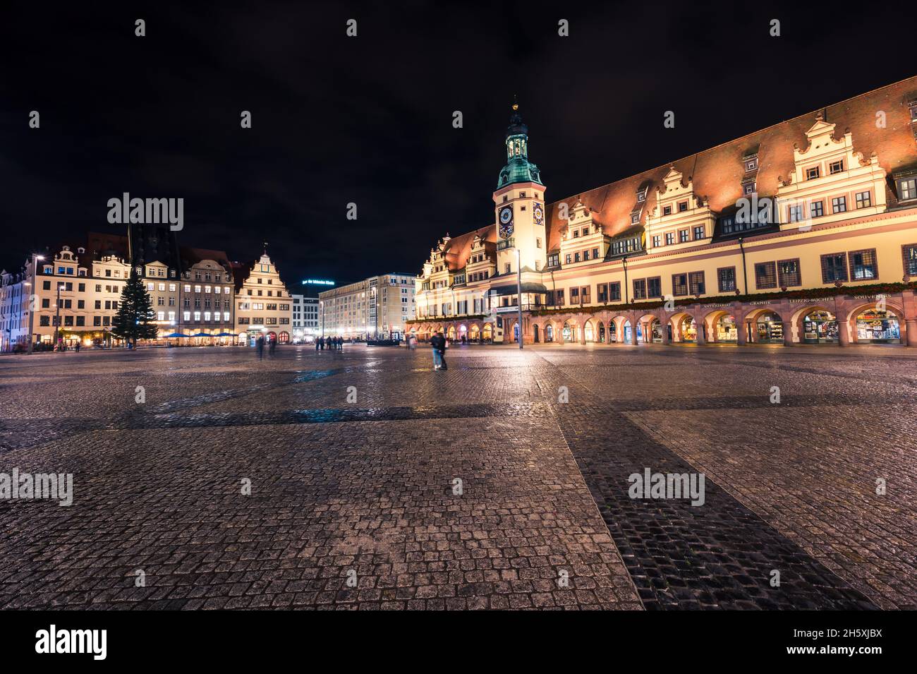 Leipzig, Germany - November 5, 2021: The empty market square in Leipzig (Saxony) at night with old city hall and Christmas tree Stock Photo