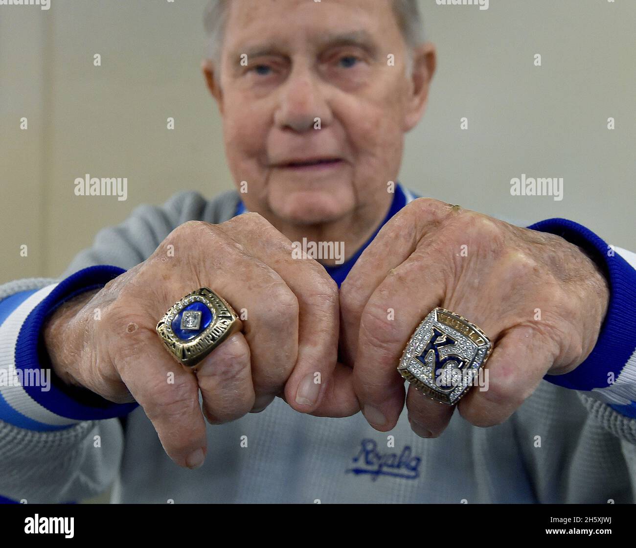 Kansas City, USA. 08th Apr, 2016. Art Stewart, the Kansas City Royals' senior advisor to the general manager, with his 1985 World Series ring on the left and his 2015 World Series ring on the right before a game against the Minnesota Twins on Friday, April 8, 2016, at Kauffman Stadium in Kansas City, Missouri. Stewart died at the age of 94, the team announced Thursday, Nov. 11, 2021. (Photo by John Sleezer/Kansas City Star/TNS/Sipa USA) Credit: Sipa USA/Alamy Live News Stock Photo