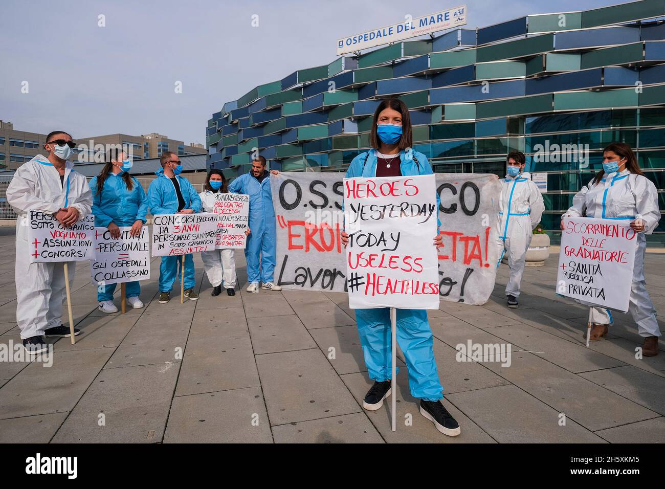 75 social and health workers made redundant by the socio-health authority in Naples are protesting in front of the hospital where until the day before yesterday they worked wearing biocontainment suits while Italy, like the rest of the world, is preparing to fight the fourth epidemic wave of COVID-19, the slogan of the demonstration is yesterday heroes today used Stock Photo