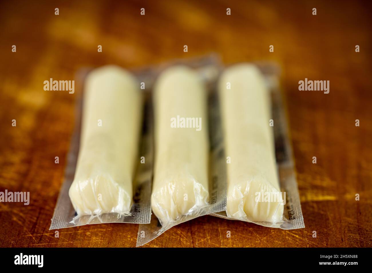 Individually wrapped cheese stick kids snack Stock Photo Alamy