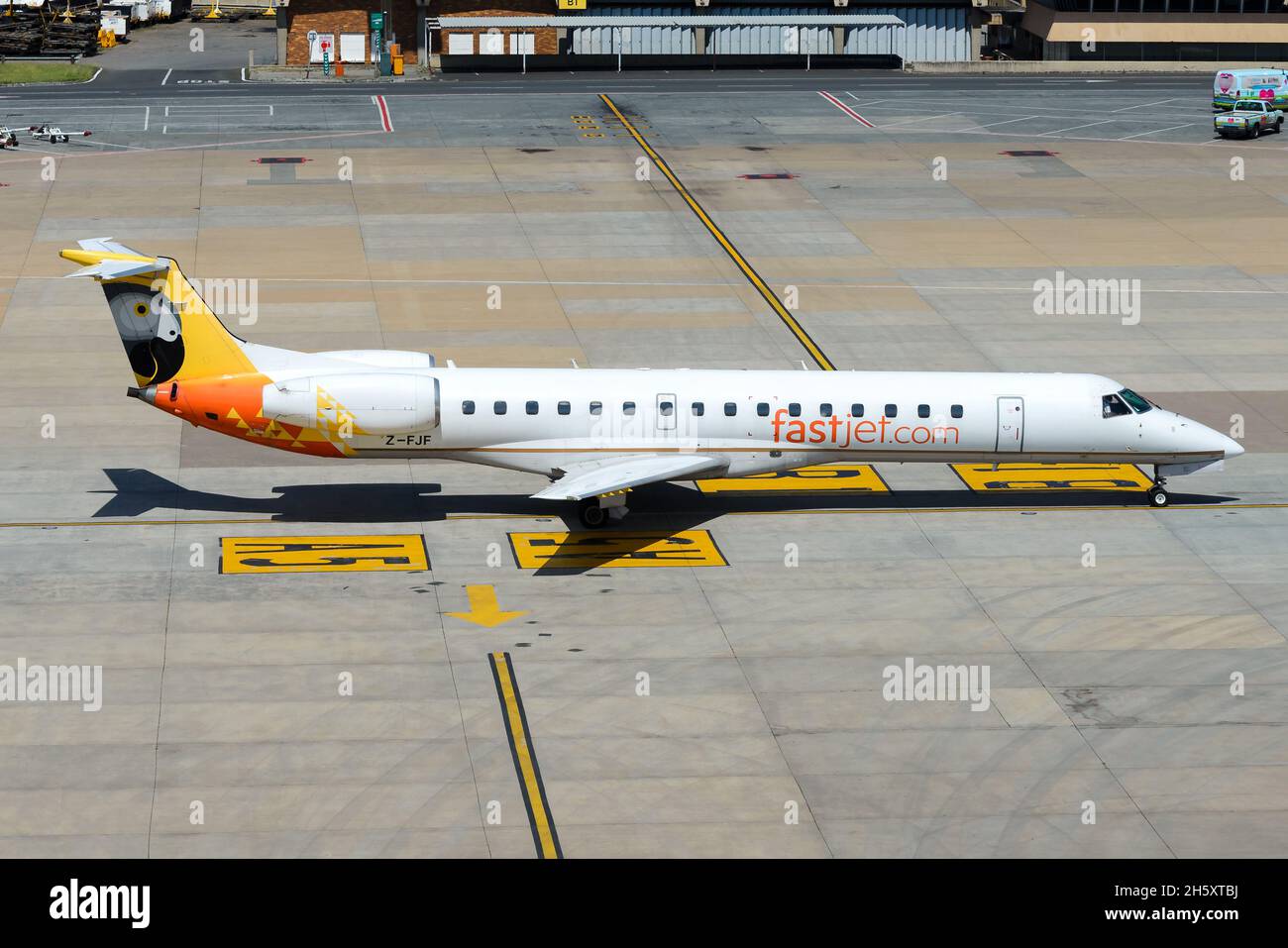 FastJet Embraer 145 aircraft taxiing inbound from Harare, Zimbabwe. Airplane Z-FJF of low cost Zimbabwean airline Fastjet Airlines. Stock Photo