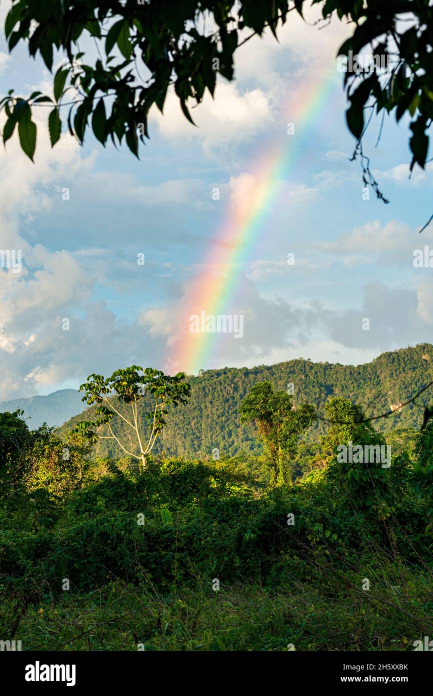 storm clouds and rainbow in the peruvian jungle Stock Photo