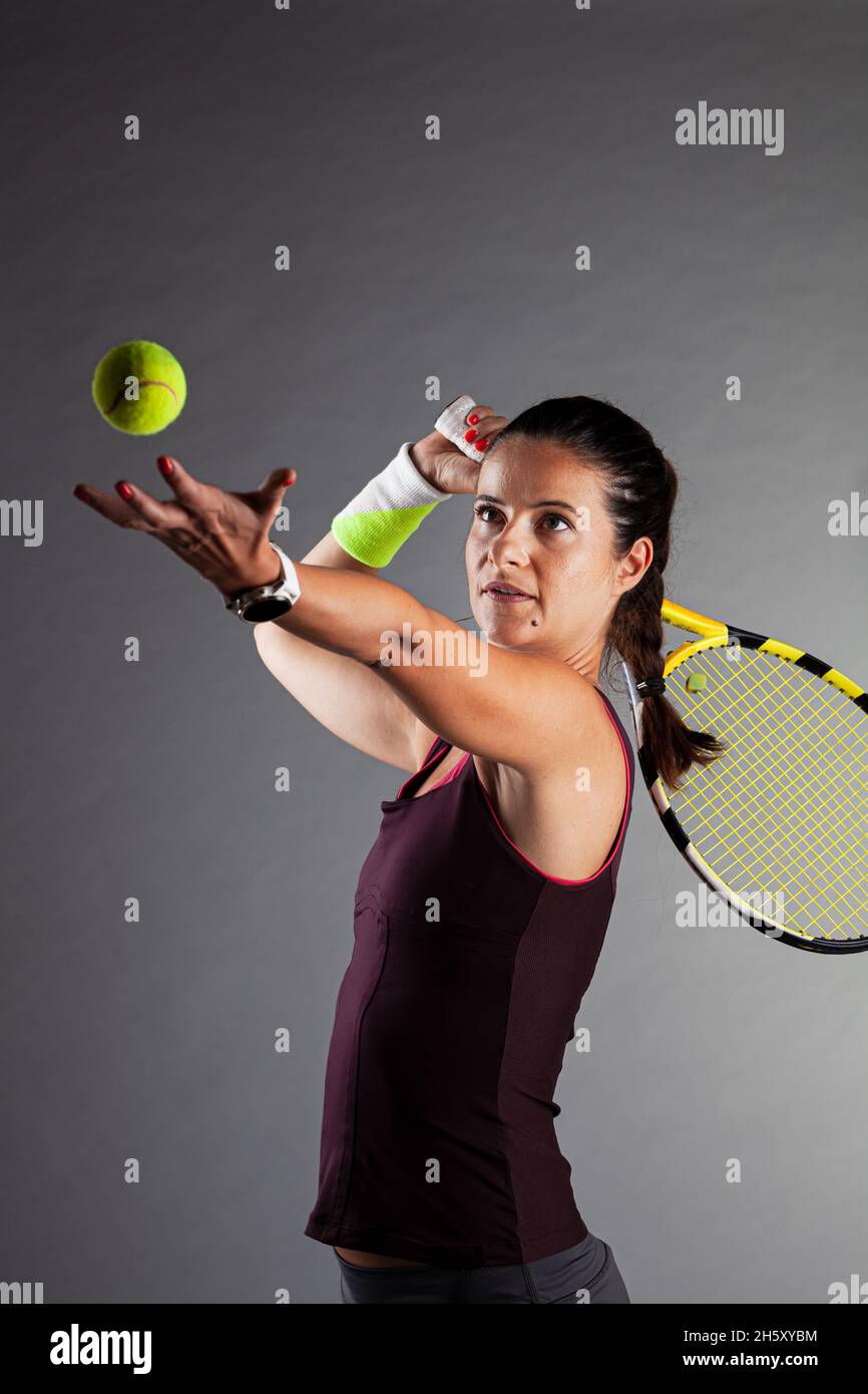 Professional female tennis player. Girl swinging racket Stock Photo - Alamy