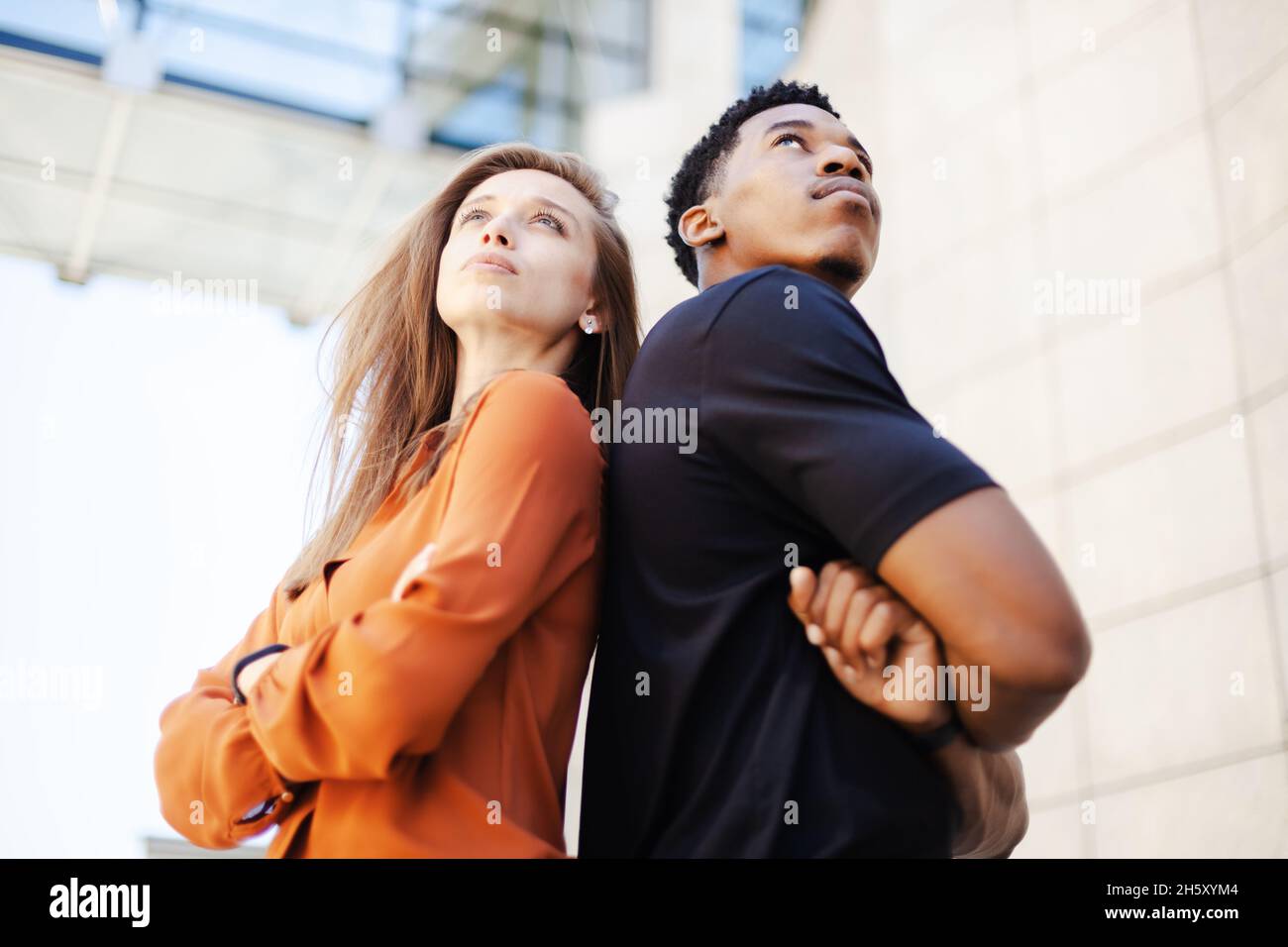 successful business couple standing in front of office center Stock ...