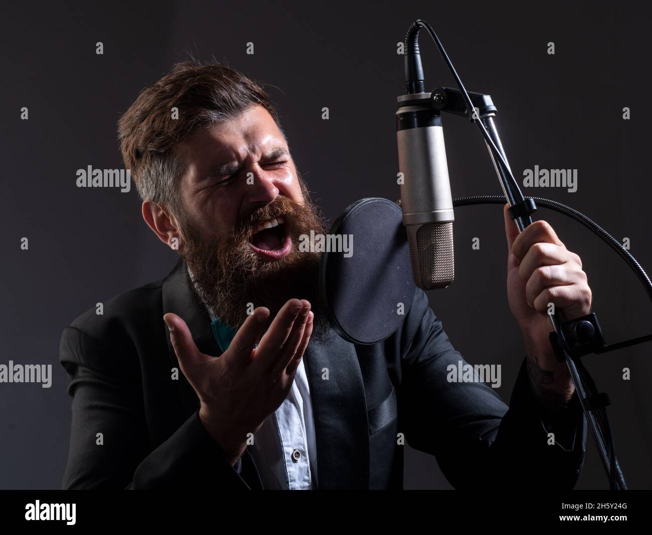 Singer is performing a song while recording in a music studio Stock ...