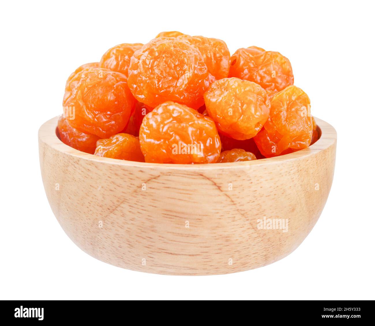 Dried prunes fruits (Preserved fruits Chinese plum) in wooden bowl