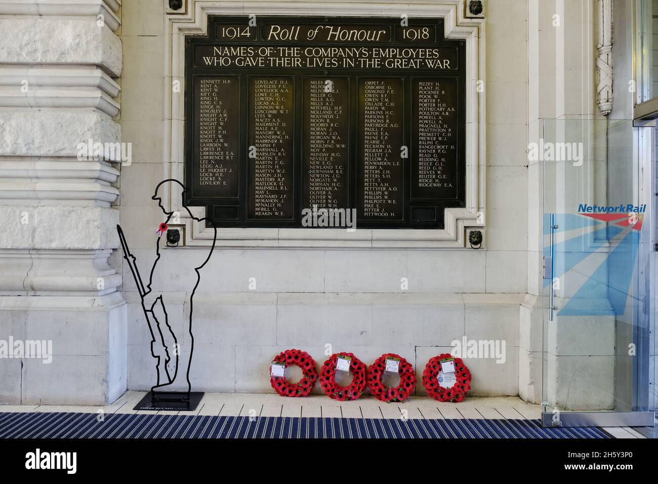London, UK. Wreaths were laid in front of the WWI war memorial in Waterloo Station for Armistice Day following a short service. Stock Photo